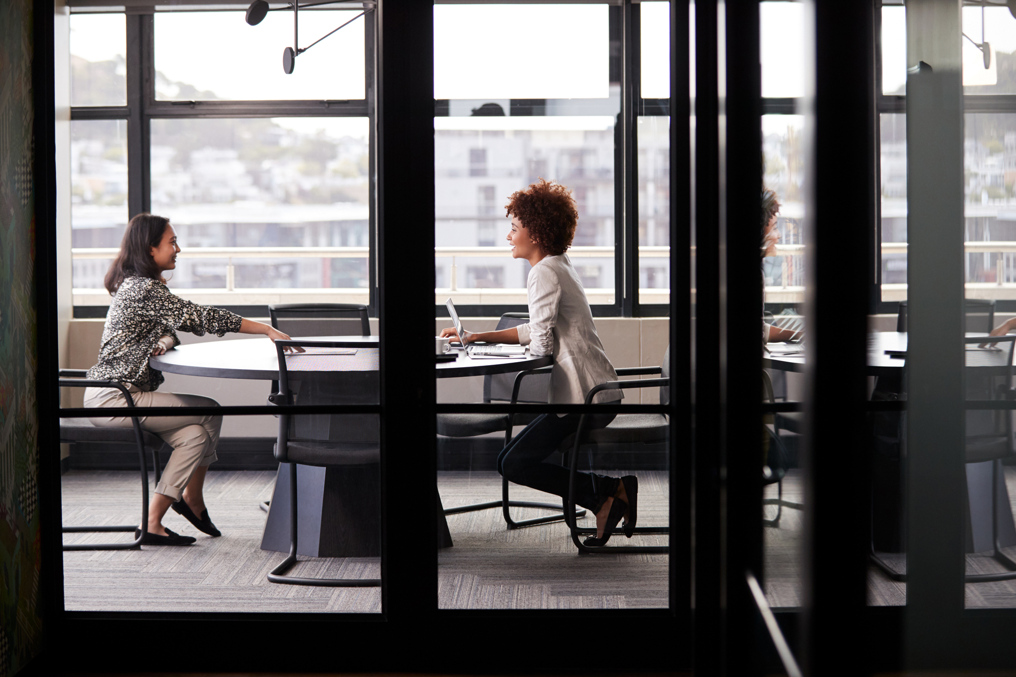 two woman meeting in conference room