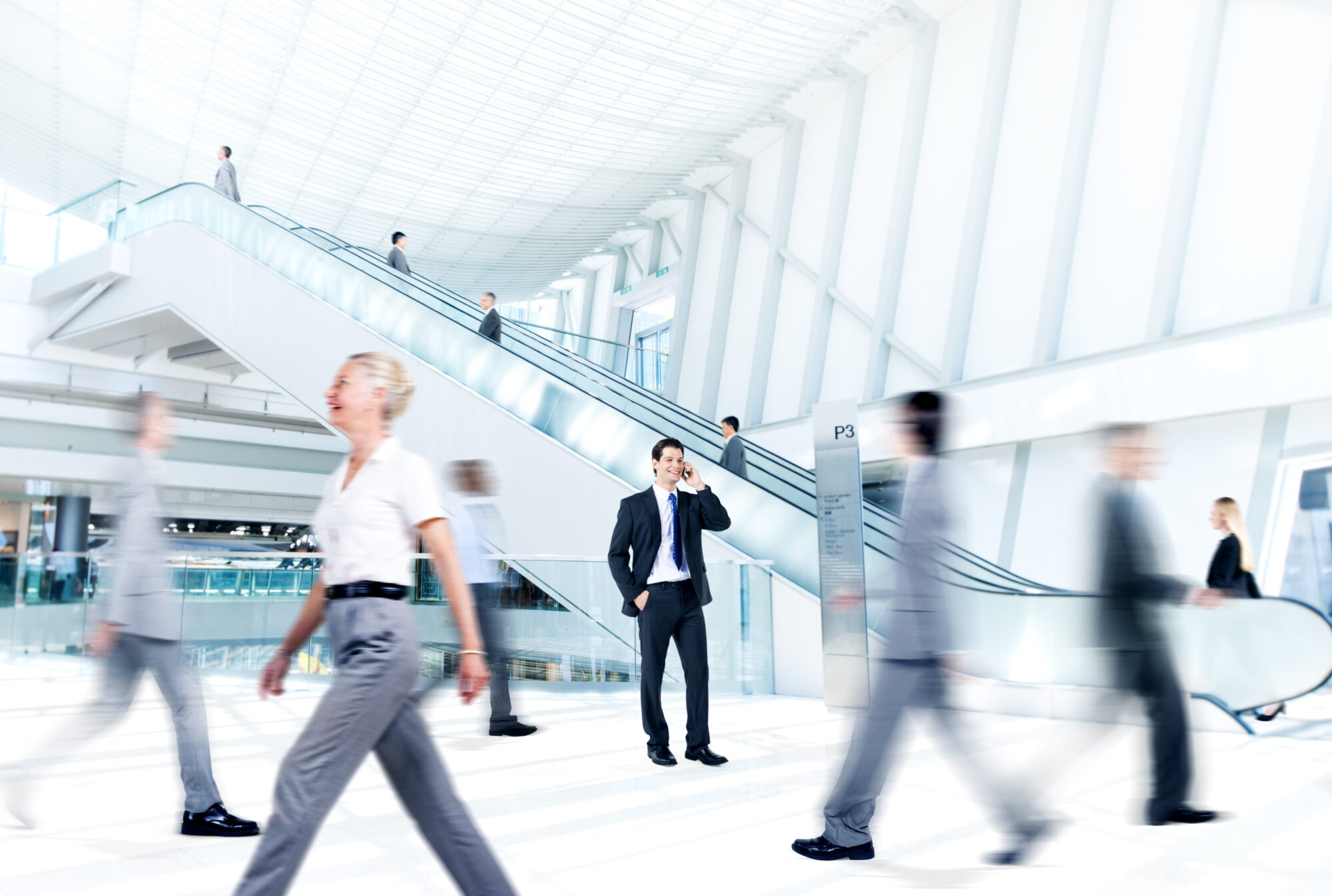 busy people walking through building